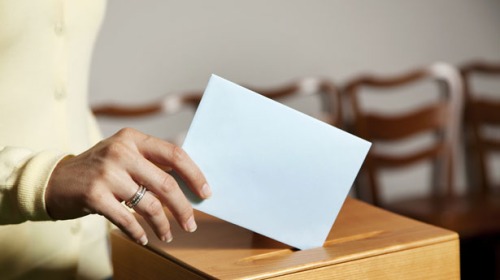 Woman-casting-a-ballot-photo-via-Shutterstock